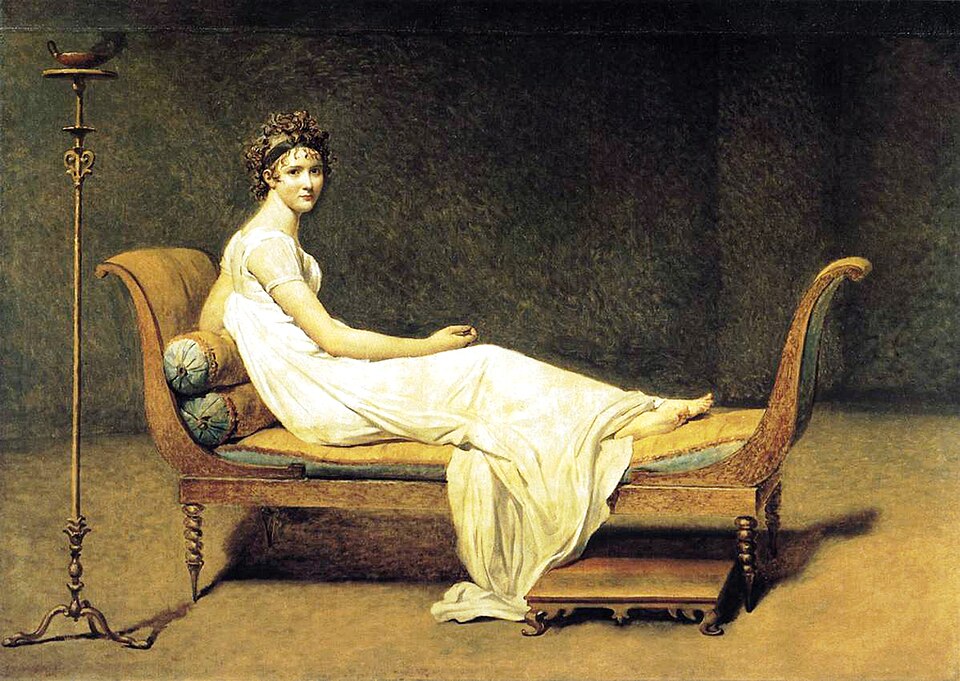 Portrait de Madame Récamier, peinture de Jacques-Louis David : Une élégante jeune femme vêtue de blanc est assise sur un divan, dans un décor…